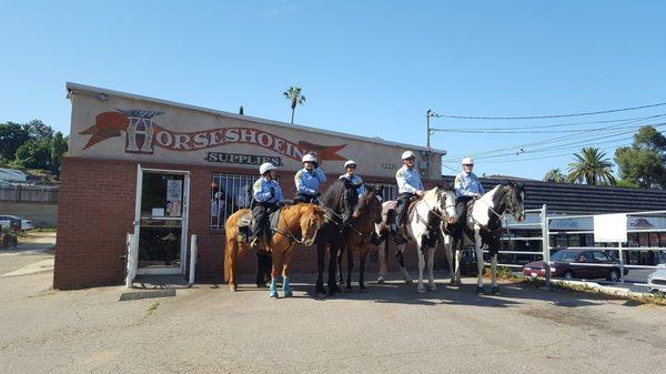 Sheriff volunteers to get a picture in front of the store