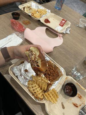 Pulled pork sandwich, waffle fries, baked beans, brisket tacos.