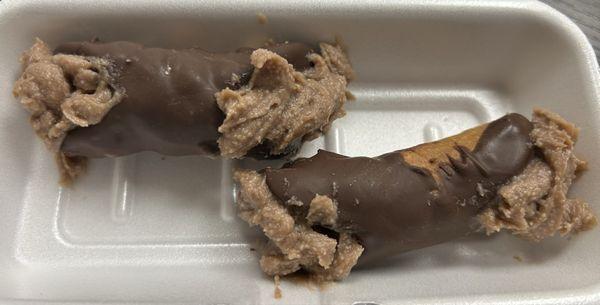 Two small chocolate cannolis with Nutella filling