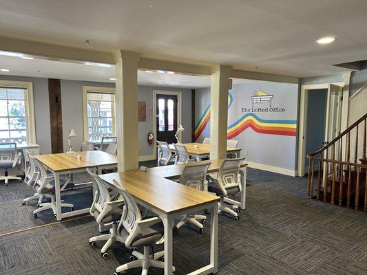 The main room and The Lofted Office mural with "Hot Desks"