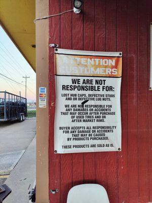 Their sign stating they aren't responsible for damage or defective products.