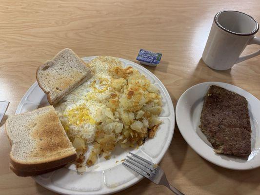 Eggs over easy, potatoes, sourdough toast, scrapple.
