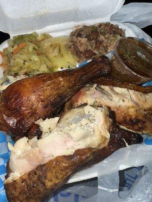 Jerk Chicken, sauce on the side with cabbage and rice & peas. Super tender.