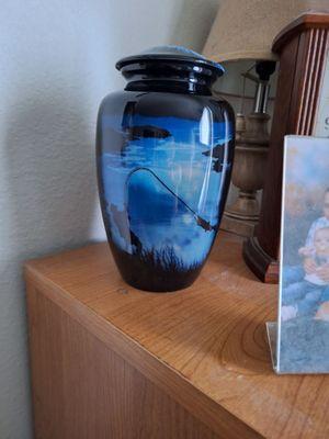 This is the urn I got because my husband loved fishing.
