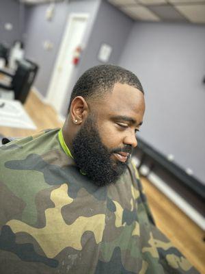 This is a taper fade on coarse hair with beard grooming.