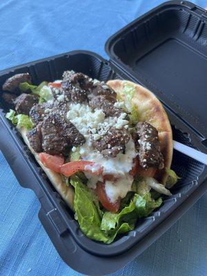 Lamb gyros with lettuce cucumbers, tomatoes, feta and the most incredible sauce. (without onion)