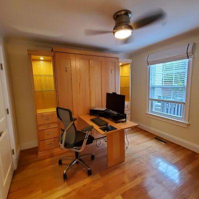 Peninsula-style desk provides ample workspace.