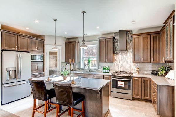 This kitchen remodel gave homeowners plenty of storage space, a gorgeous glass-front pantry door, and modern, energy-efficient appliances.