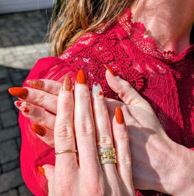Fall-themed acrylic nails with nail extensions