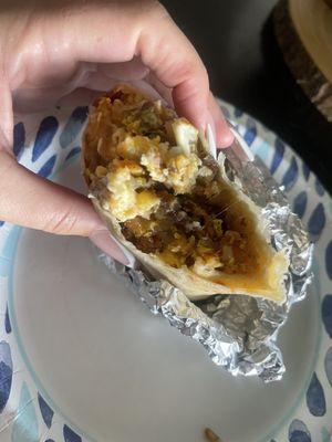 Breakfast burrito with bacon and sausage