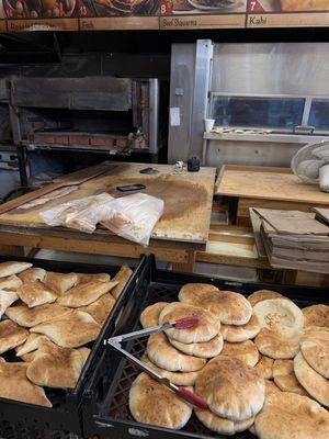 Fresh baked pitas and breads, and the bread ovens