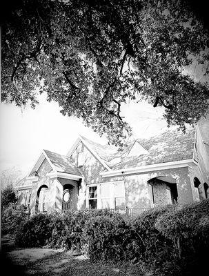 A welcoming, professional brick office--home of JOHNSON CARROLL LAW in Shreveport, where expert legal support meets approachable client care