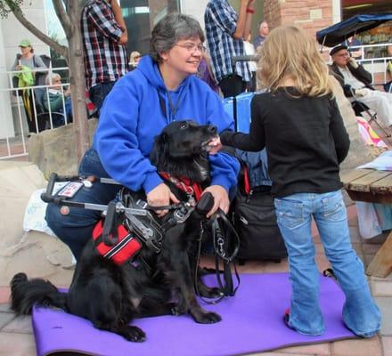 Izzy and Colleen at FACE's FlatIrons concert with Domino Service Dogs