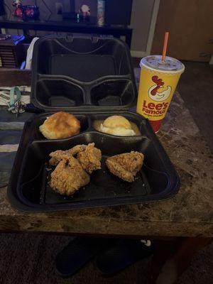 Three spicy wings, biscuit and mashed potatoes and gravy