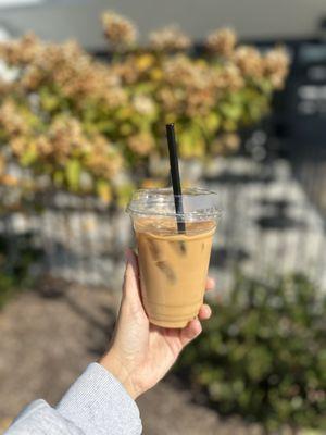 Iced vanilla latte with oat milk