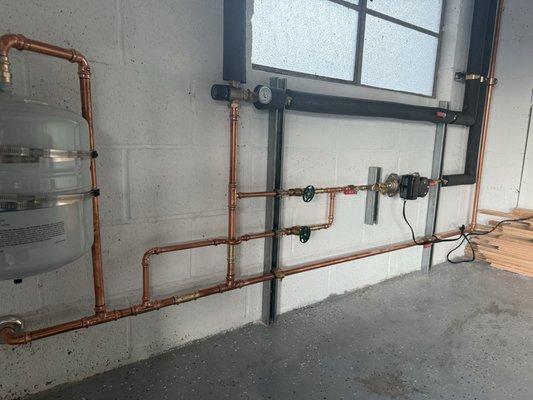 Groundpos Alpha series pump with Caleffi mixing valve for heat pump water heater