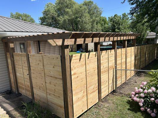 Horizontal cedar fence with pergola