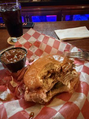 Absolutely delicious pulled pork very tender on a soft brioche toasted bun and baked beans