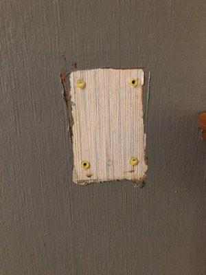Looks like it used to have a wall phone of some kind or something I don't know what this even is just part of what they've left on the wall