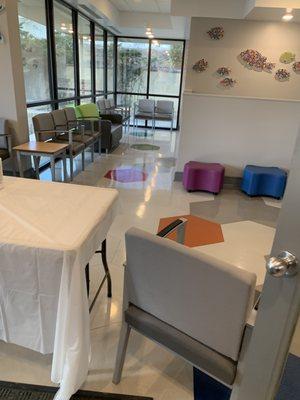 Blocked off waiting area. You wait in car as of Feb 2022