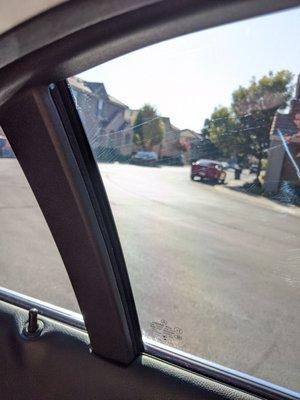 Scratches covering every piece of tint in the car.