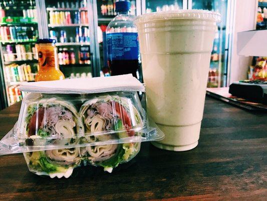 Turkey and cheese wrap with avocado and a banana, oatmeal smoothie