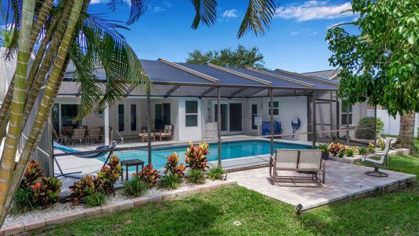 New price: $737,000! Stunning 4-bed, 2-bath home in NW Bradenton's Pine Meadow with impact windows, heated pool, & no HOA! #IanSellsFlorida