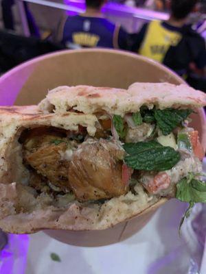 Chicken kebab sandwich (tomato salad with cucumber and red onion , shredded cabbage, fresh herbs, kebab sauce and harissa - $20)