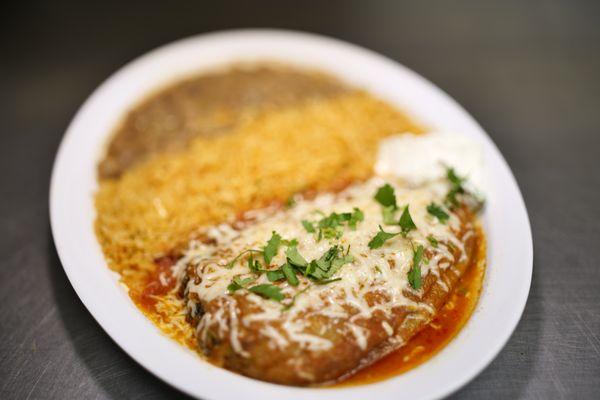 Chile relleno filled with quest fresco served with rice and beans. Don't forget to add on tortillas Amano.
