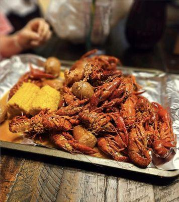 Cajun Kitchen featuring Louisiana Crawfish, Shrimp, Crab and all the sides: Corn, Potatoes, and Saus