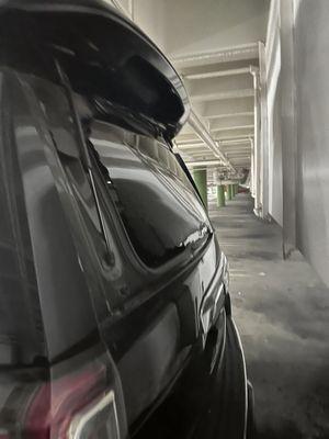 This is another vehicle next to ours that BROKE THEIR BACK WINDOW and completely damaged the rear spoiler!