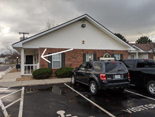 After entering the parking lot, continue past the first building. you'll find building 2 on the left