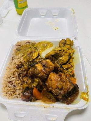 Curry chicken and jerk chicken, with rice and beans and dumplings.