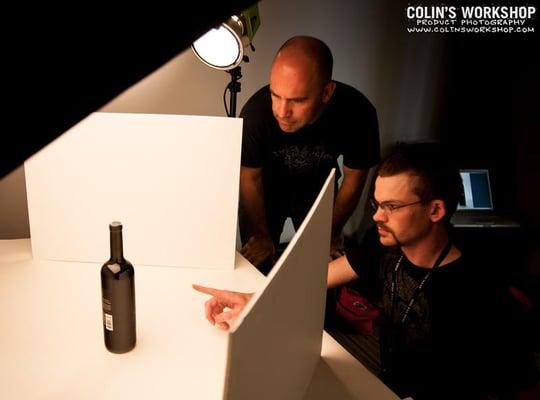 Colin and Damion pretending like they know how to photograph a wine bottle.