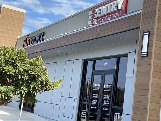 In the shopping plaza to the left of entry restorations and the right of interior fusion furniture