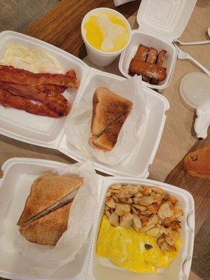 Western omelet, breakfast platter with grits, French toast sticks