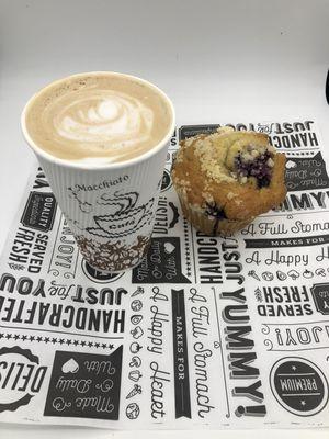 A latte and a fresh blueberry muffin