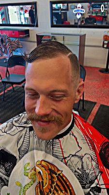 High fade with comb over and hard part