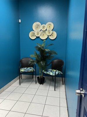 Small sitting area near restrooms.