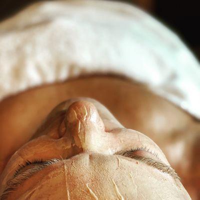 Signature facial with a Turmeric & Banana skin tightening mask.