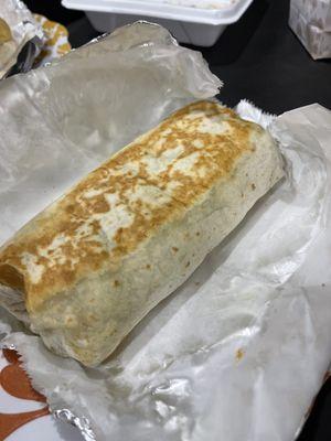 Veggie burrito: black beans, rice, corn, spinach, pineapple, onion, guacamole, tomato and chipotle sauce.