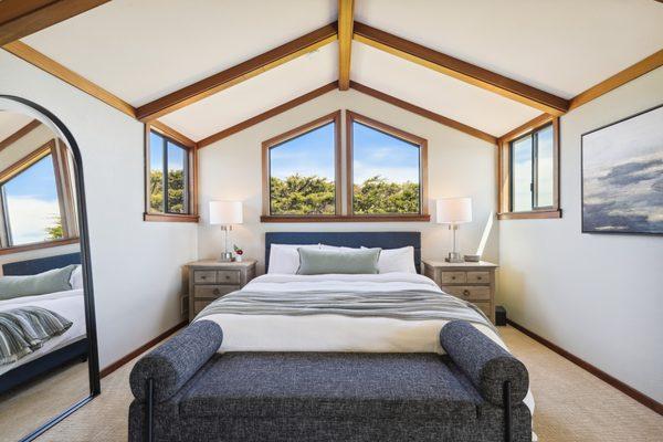 The bright and airy loft boasts a king size bed and lots of windows.