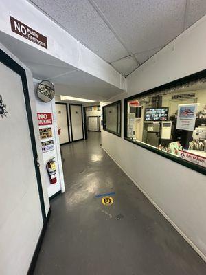 Office and hallway to storage units.