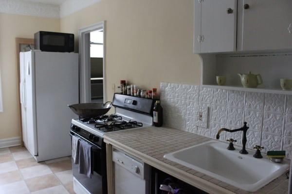 Kitchen repainted with "macadamia nut" color from Benjamin Moore.