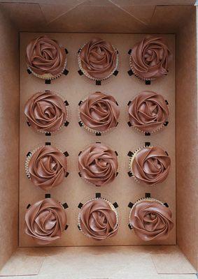 Vanilla cupcakes with chocolate buttercream.