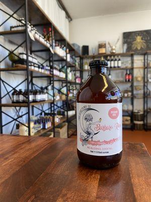 Barbara Rose Seasonal Alcohol Free Shrub Cocktail made with rhubarb + rose shrub, turmeric + rose hips honey, lime juice and orange blossom.