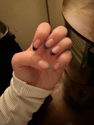 Multi color blue tipped nails.