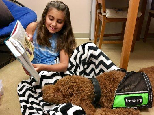 JuJu loves to hear our students read to her!