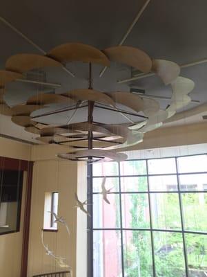 Beautiful giant bird mobile in the center of the spiral staircase in the lobby (view at the top)