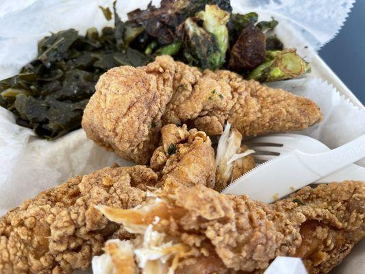 Chicken tenders fried to perfection with collard greens & fried Brussels sprouts